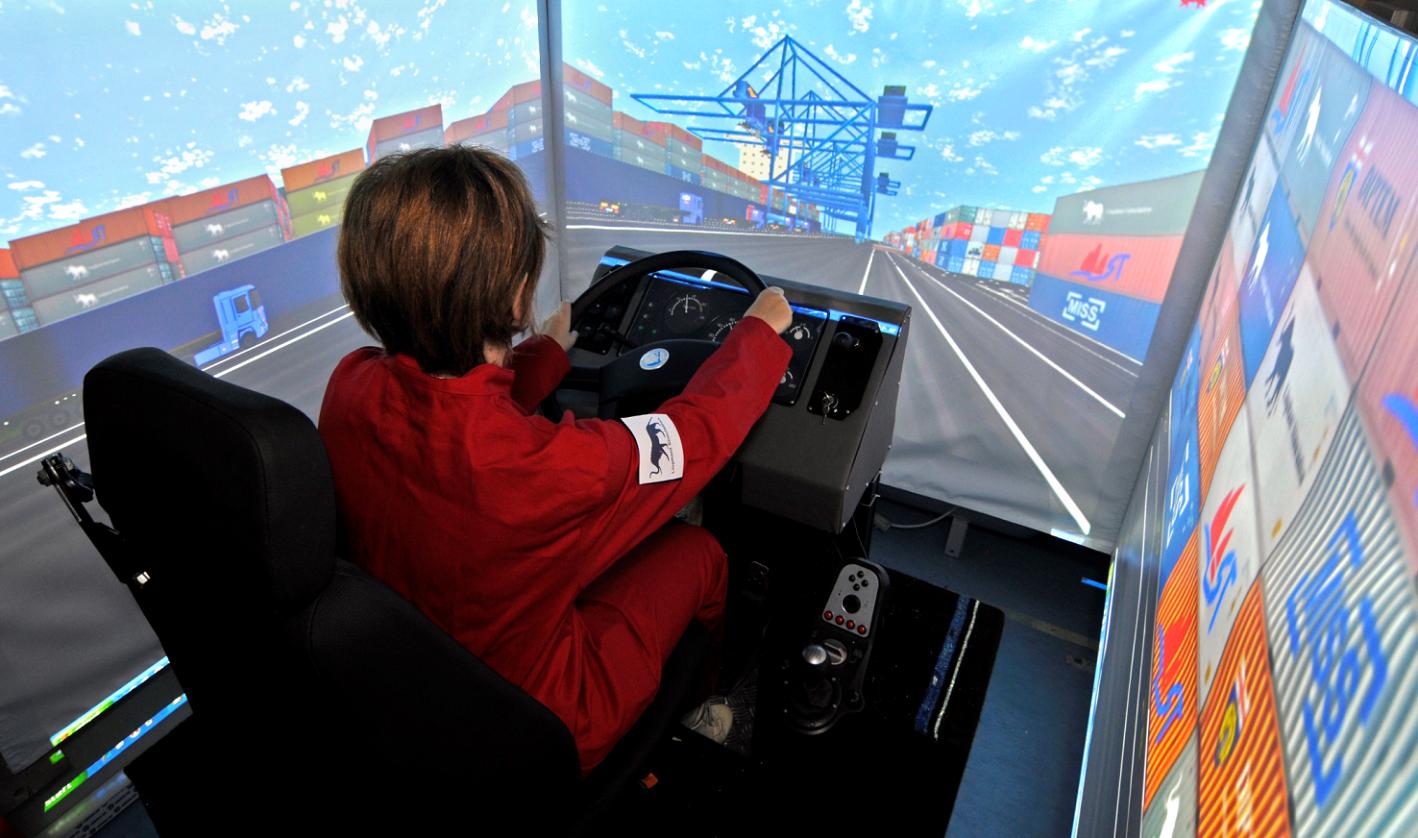 Marina Massei, Project Controller and Simulation Lab Responsible in Simulation Team MISS DIPTEM, testing ST_RS Simulator for trainig truck drivers in driving, operations and procedures within Intermodal Terminal